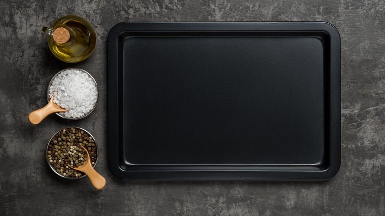sheet pan on counter with bowls of spices