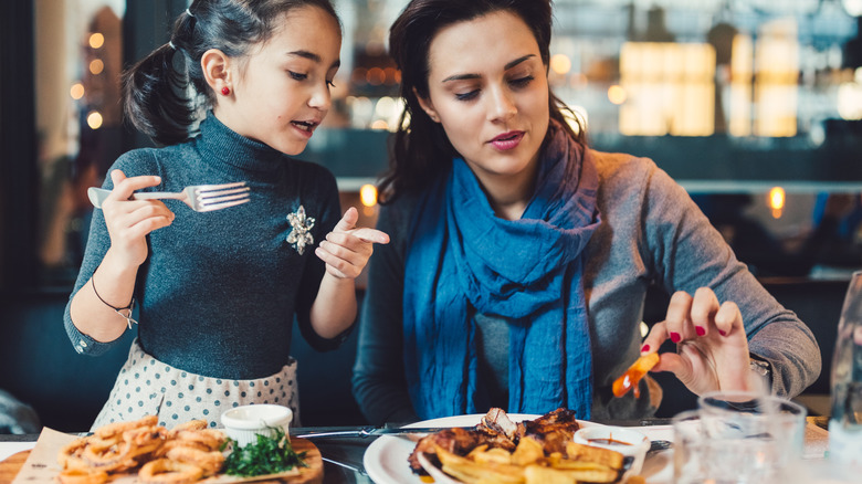 woman and child at restaurant