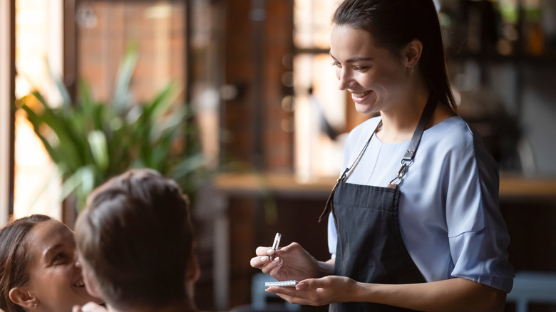 server smiling at customers