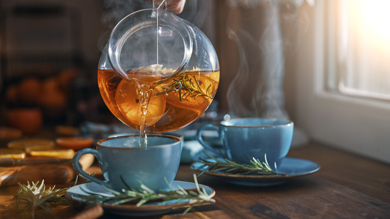 Tea pouring into a cup