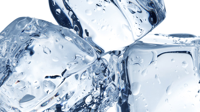 Stacked ice cubes on a white background 