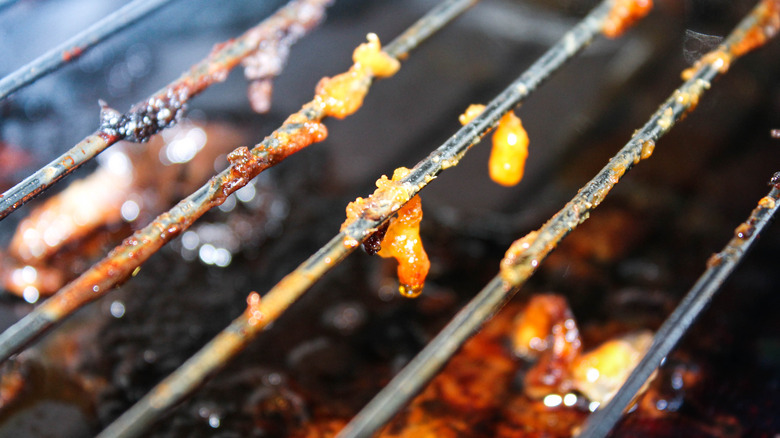 Meat and fat on grate