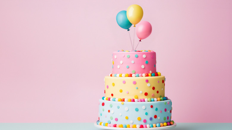 colorful 3-tiered birthday cake with fondant