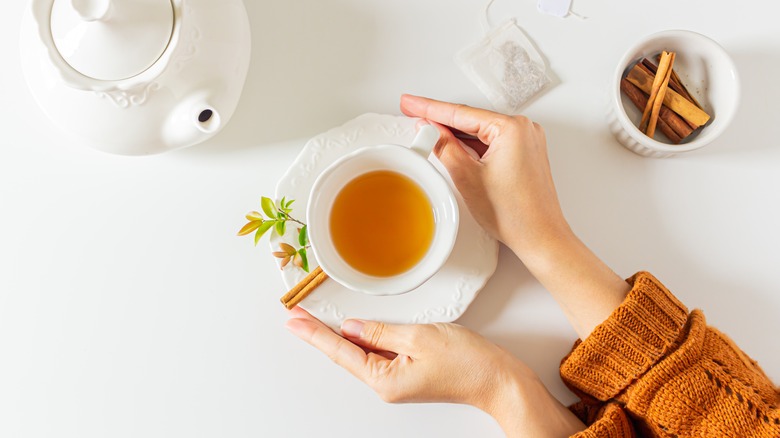 Hands around a cup of tea