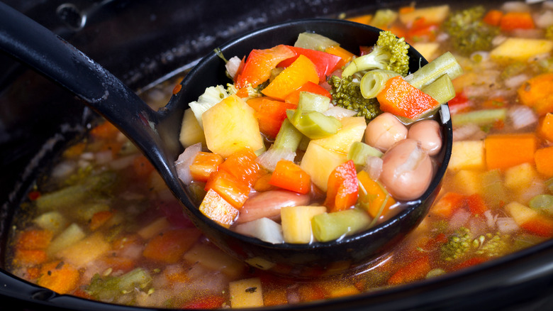 ladling vegetables from slow cooker