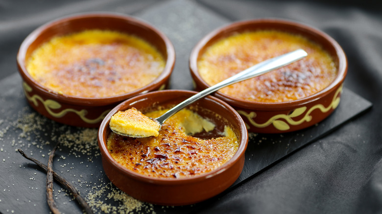 Three ramekins of creme brulee
