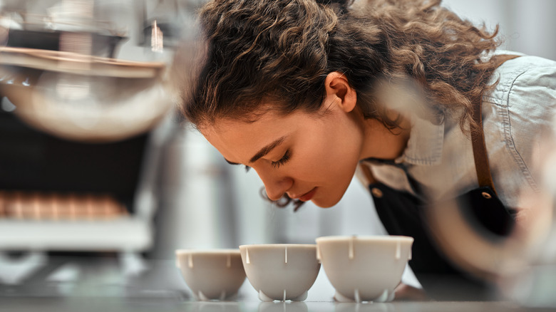 Barista sniffing coffee 