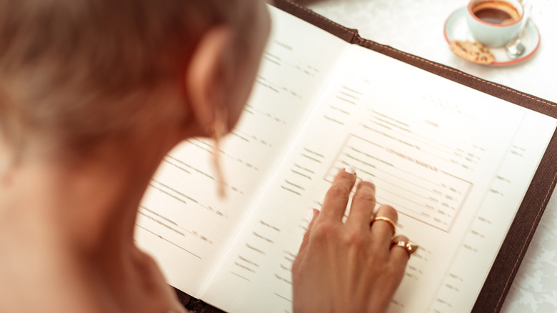 woman reading menu