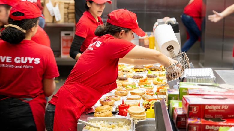 Woman working in Five Guys restaurant