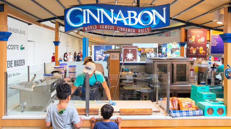 People ordering at cinnabon