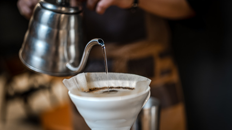 Pouring water into pour-over coffee filter
