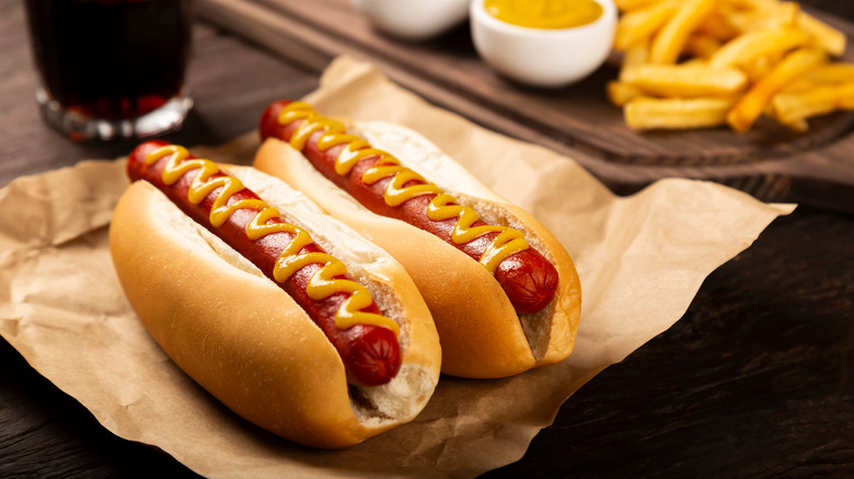 Hot dogs on buns with mustard