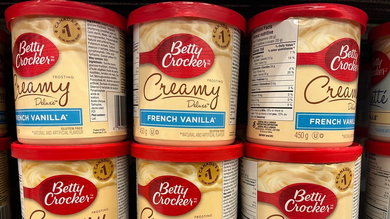 Frosting cans on shelf