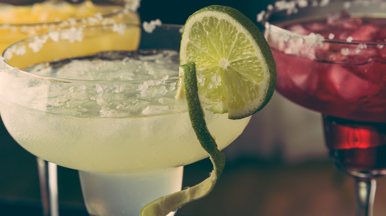 Up close of a margarita with lime twist