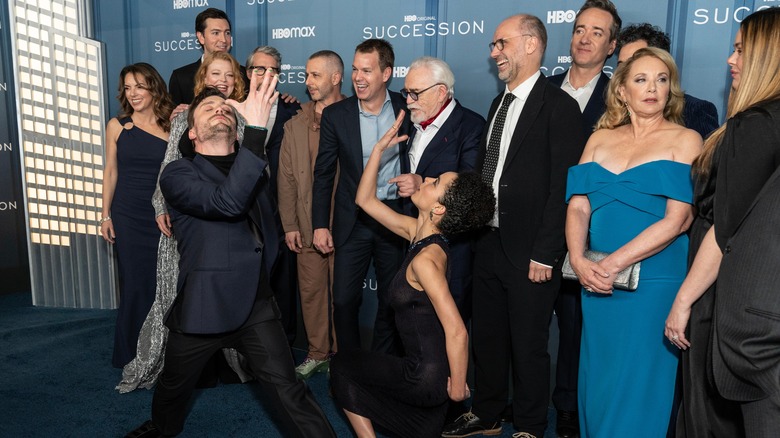 Cast of 'Succession' posing on blue carpet