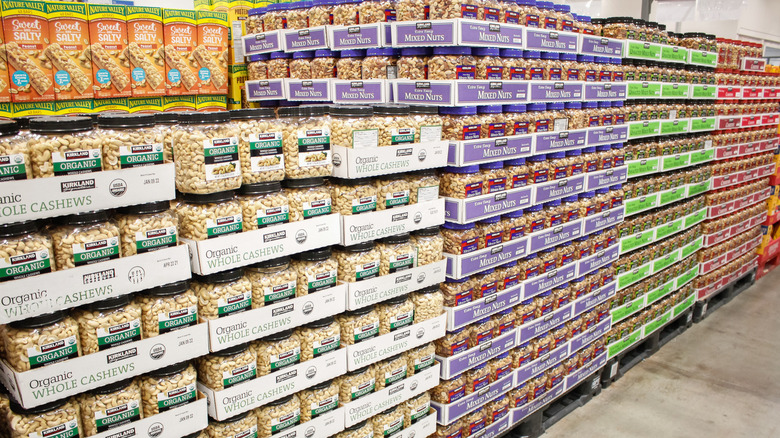 Rows of Costco nuts lined up on the floor of a warehouse