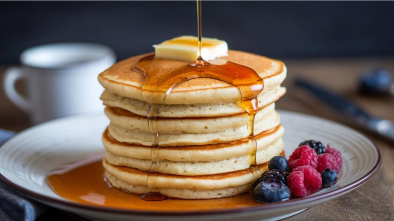 Pancakes on a plate with syrup.