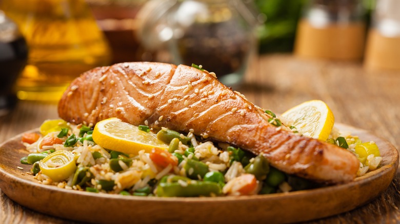 Cooked salmon over rice 