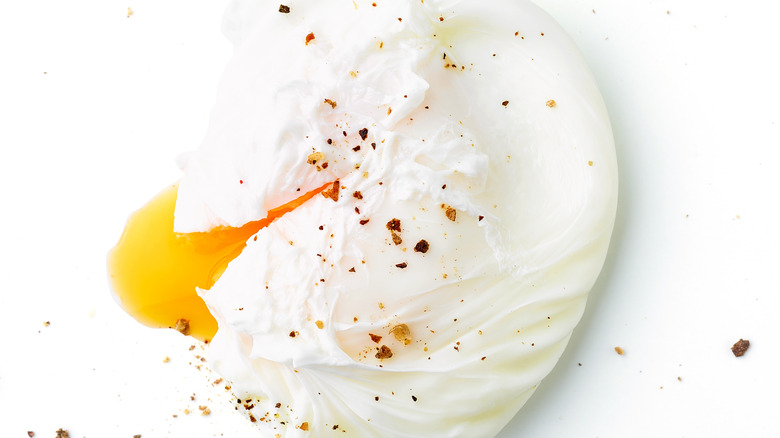 single poached egg with pepper