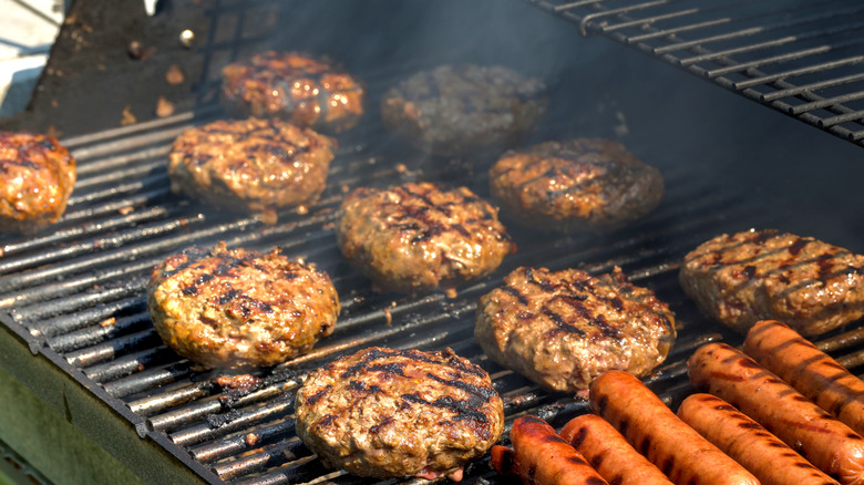 burgers and hotdogs on barbeque