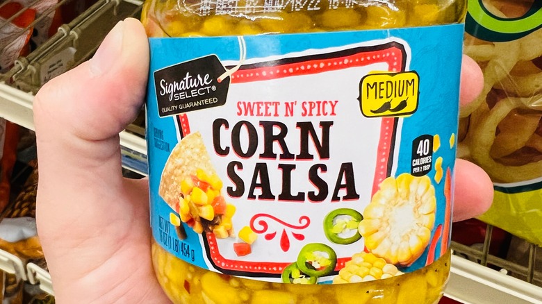 Signature Select salsa in hand