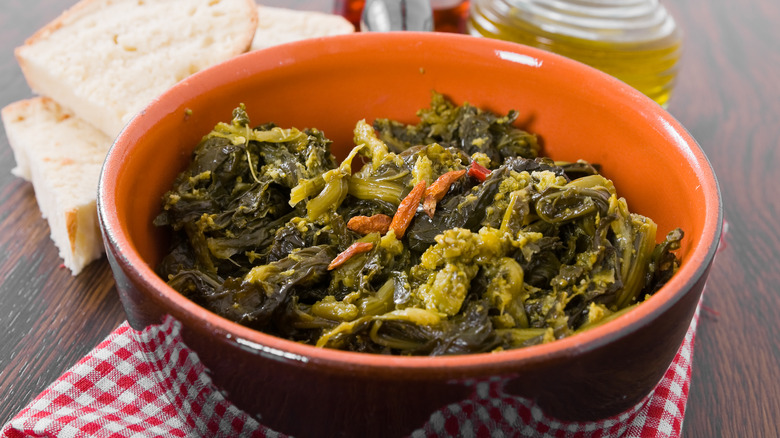 A pot full of stewed turnip greens