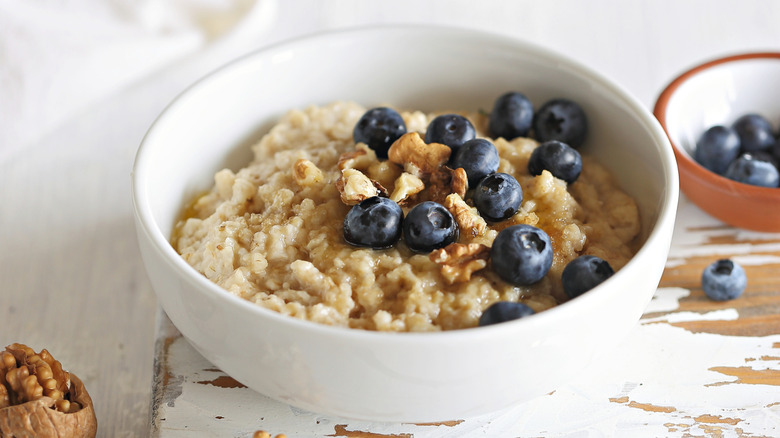 Bowl of oatmeal with blueberries and walnuts