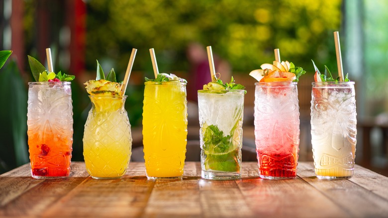 Six tropical cocktails on bar