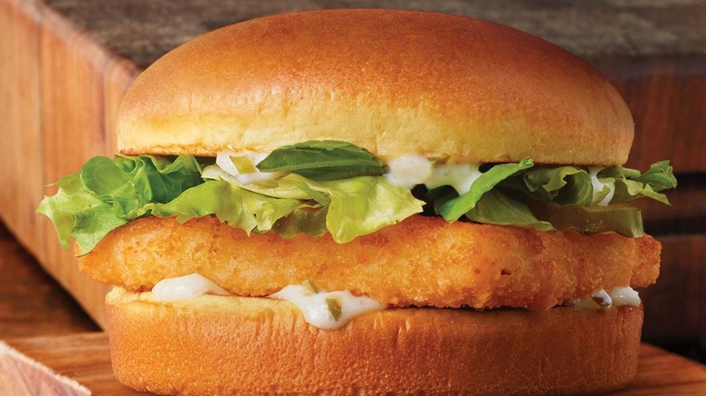 Burger King's Big Fish Sandwich against wooden background
