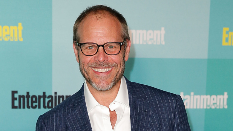 Alton Brown smiling at an event for Entertainment magazine