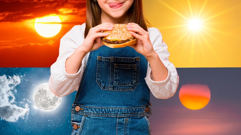 woman holding a burger