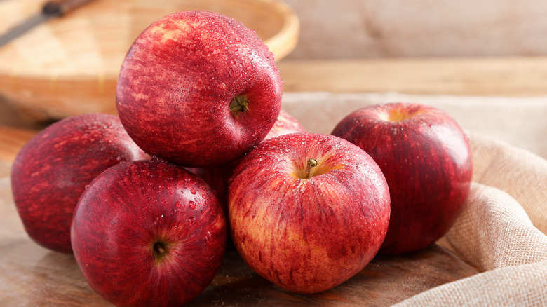 Gala apples on wooden board