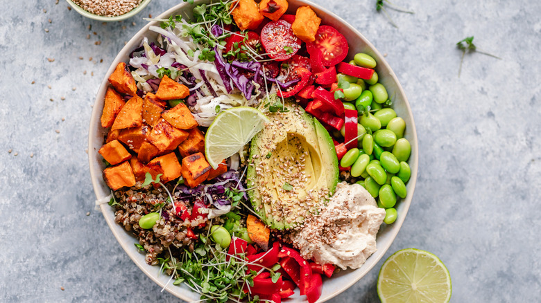 A bowl of salad loaded with ingredients