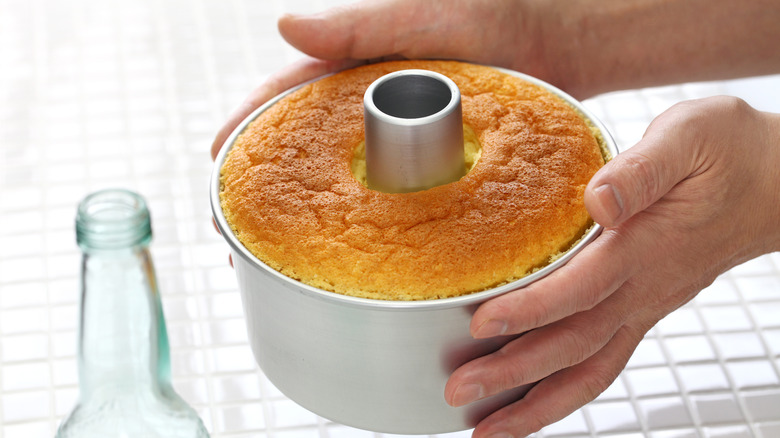 Hands holding tube pan