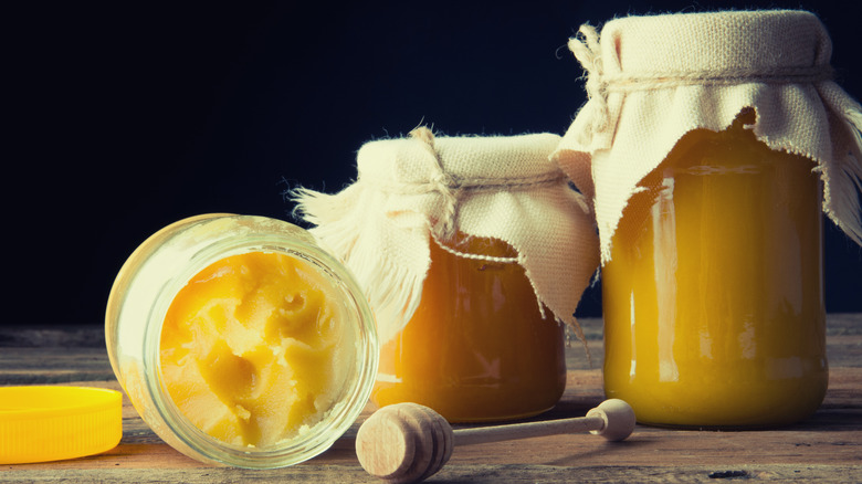 three jars of raw crystallized honey