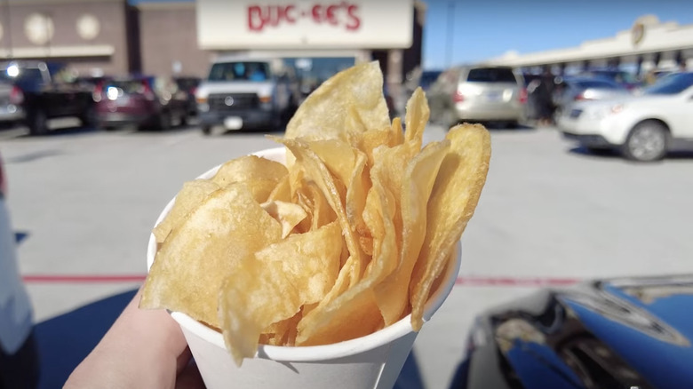 Paper cup overflowing with Beaver chips