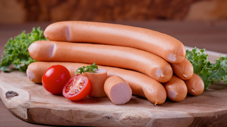 frankfurter sausages on a cutting board