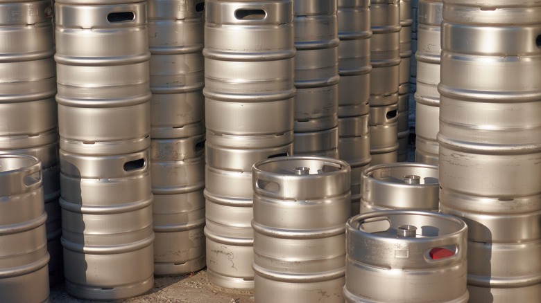Stacks of metal kegs