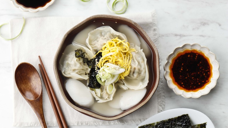 Korean tteokguk soup with sauces