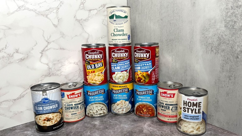 Stacked cans of various clam chowders