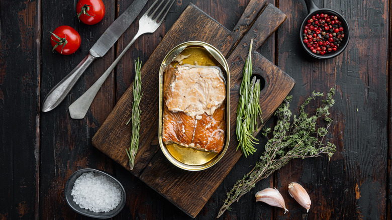Canned salmon on cutting board