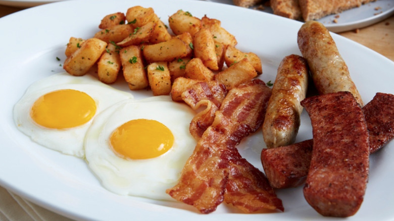 eggs, sausage, potatoes, and bacon