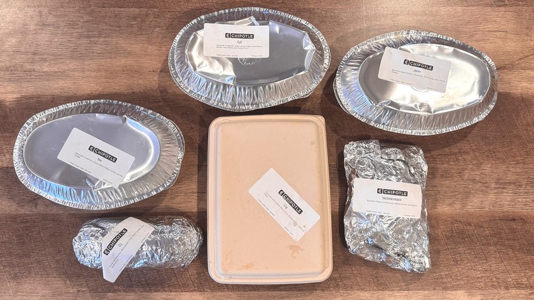 Various containers of Chipotle meals