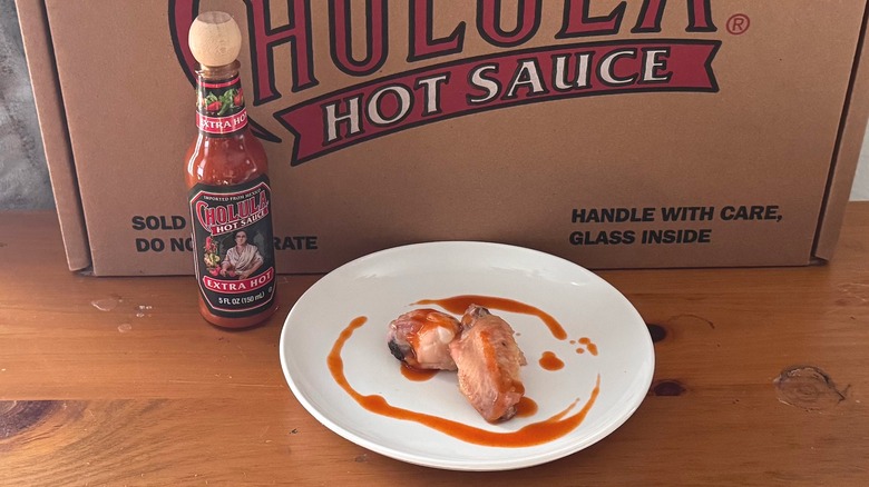 Cholula Extra Hot sauce with wings