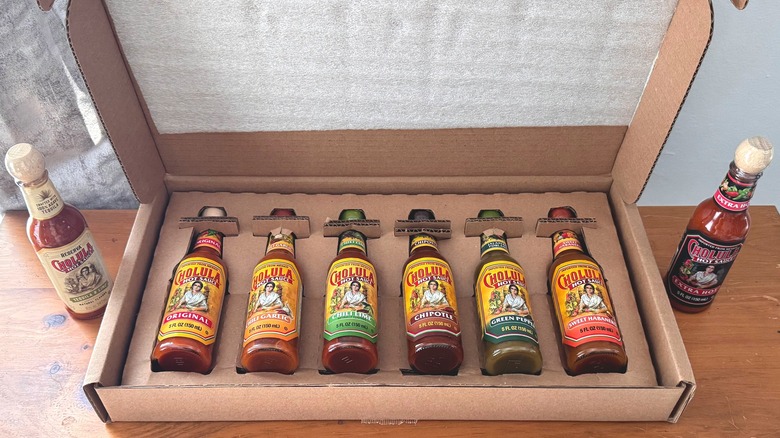 Box of Cholula hot sauces on table