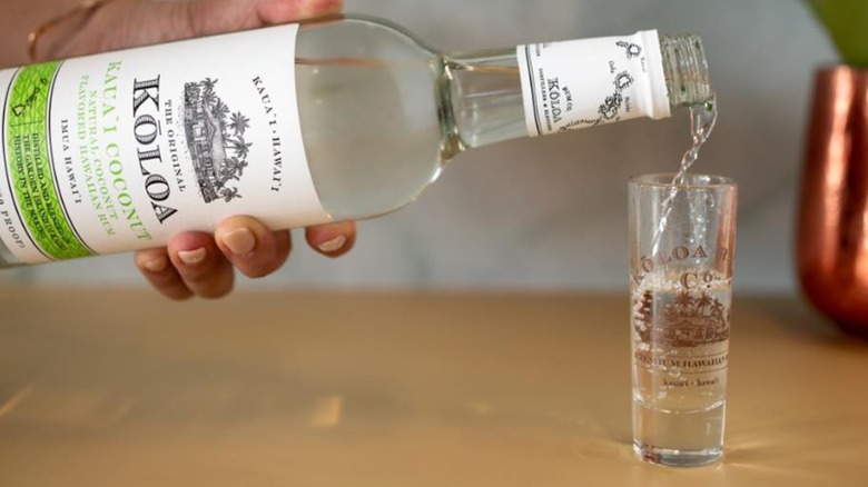 Close up of bottle and shot glass filled with Kōloa Kaua'i Coconut Rum