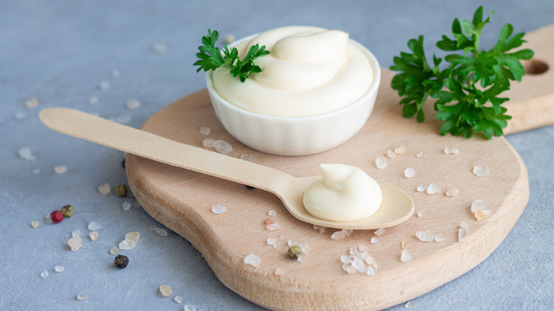 Bowl and spoon of mayonnaise