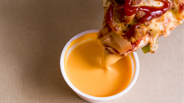 Pizza and nacho cheese sauce