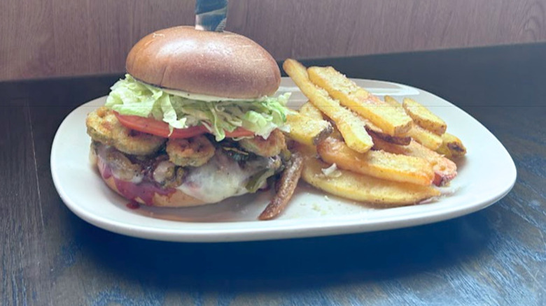 Red Robin's Scorpion Burger and french fries on a white plate