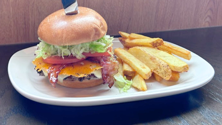 Red Robin's MadLove burger and fries on a white platter